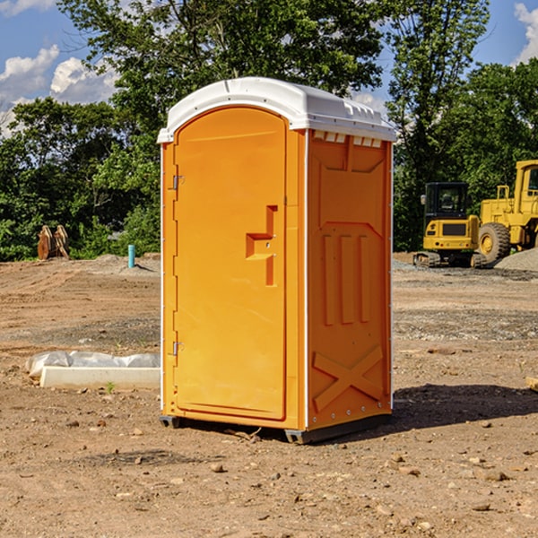 what is the cost difference between standard and deluxe portable restroom rentals in Ranier